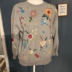 Johnny was size small grey 3/4 sleeve Martine flower embroidered sweat shirt.